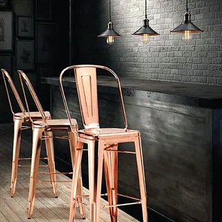 Bar stools at a black bar